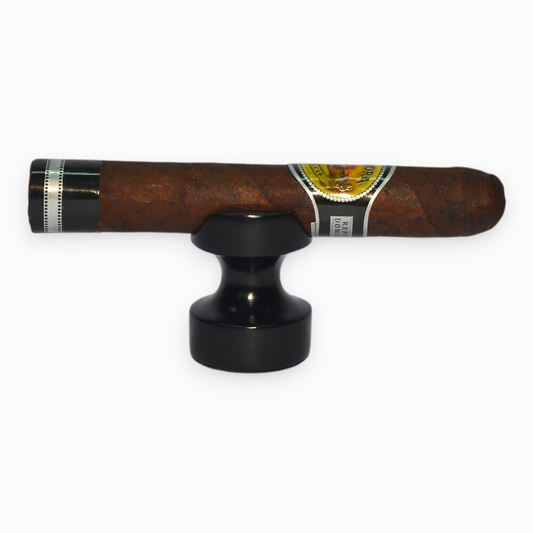 Cigar with a black holder on a white background